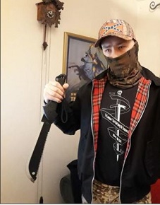 Adam Thomas with a machete