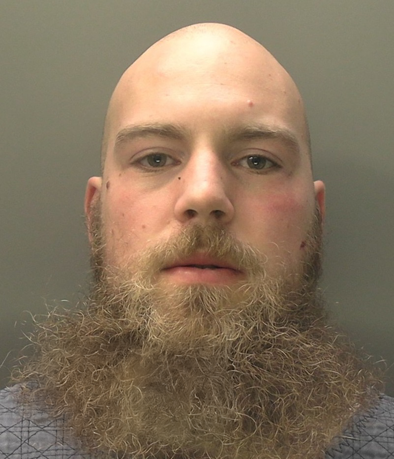 Alexander Dighton, a white man with a bald head and large beard
