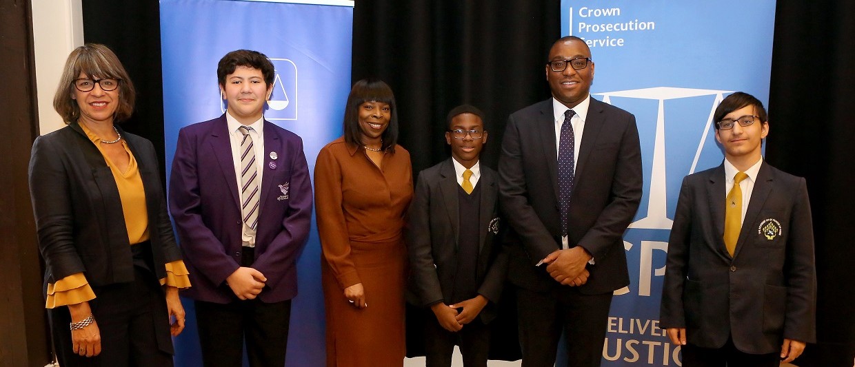 Photo of: Crown Prosecution Service Chief Executive Rebecca Lawrence, student Adam Akkus from the Academy of St. Nicholas, Director of Legal Services Grace Ononiwu, student Cristiano Batista from St. Francis of Assisi, original Anthony Walker scholar Nathan Meibai and student Melad Azzan from St. Francis of Assisi