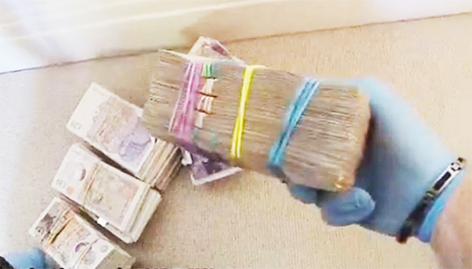 Piles of cash discovered during police searches connected to Wen