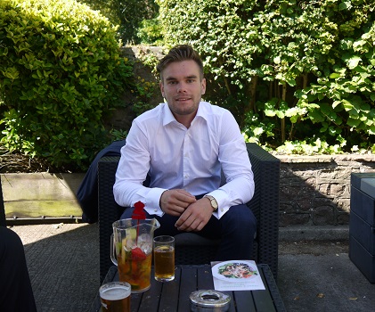 David Haw sitting on a chair