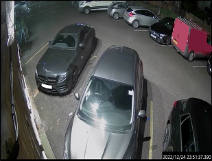 Black Mercedes car parked at pub
