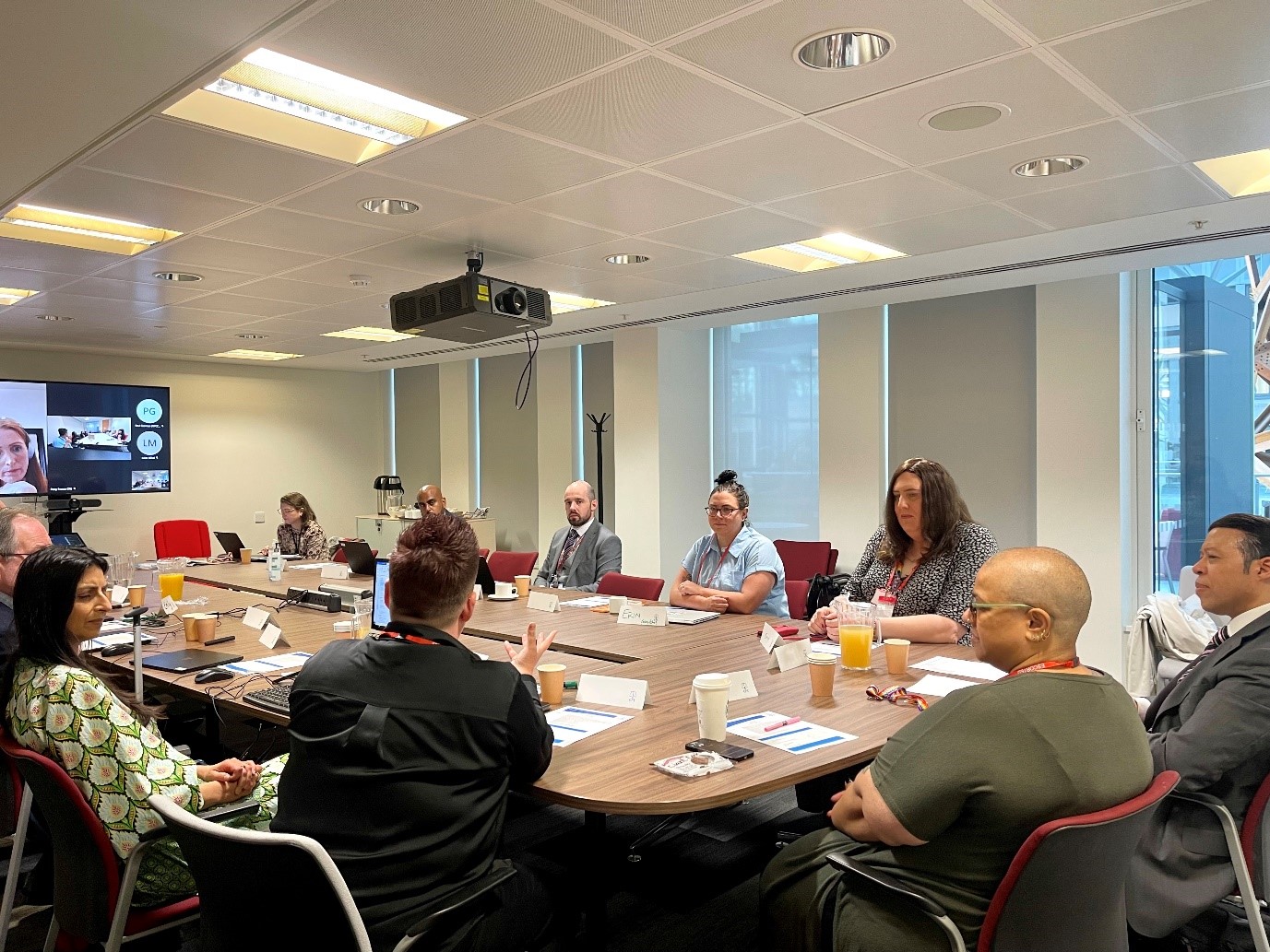 Attendees online and in person discussing Homophobic, Biphobic and Transphobic hate crimes