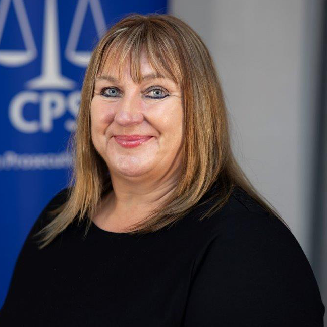 Suzanne Llewellyn, National Mental Health Lead, faces the camera in front of a CPS banner background