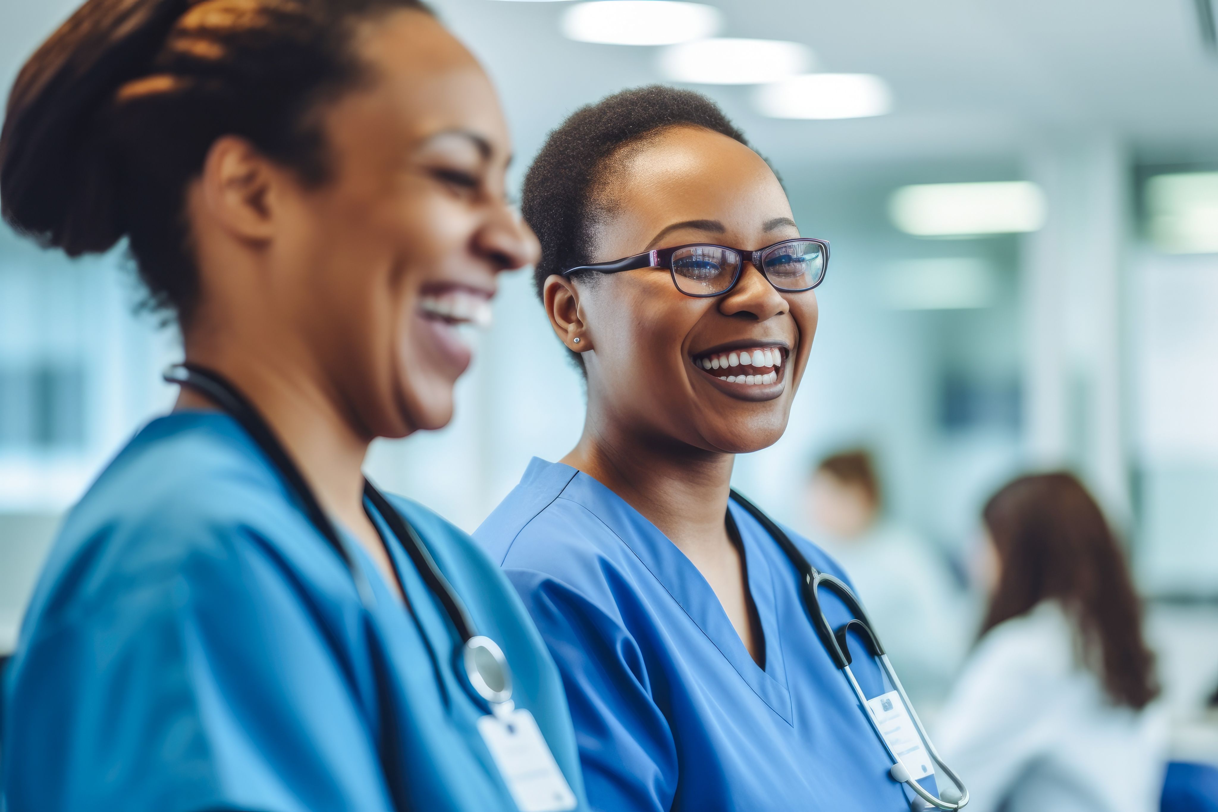 Candid shot of two nurses laughing and talking in a hospital