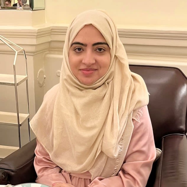 Head and shoulders photo of CPS employee Sofia, wearing a cream coloured hijab. 