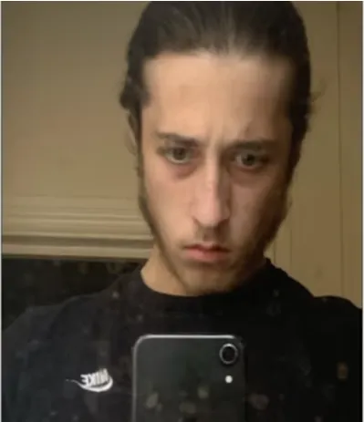 Alfie Coleman, a white man with dark brown hair and a short beard.