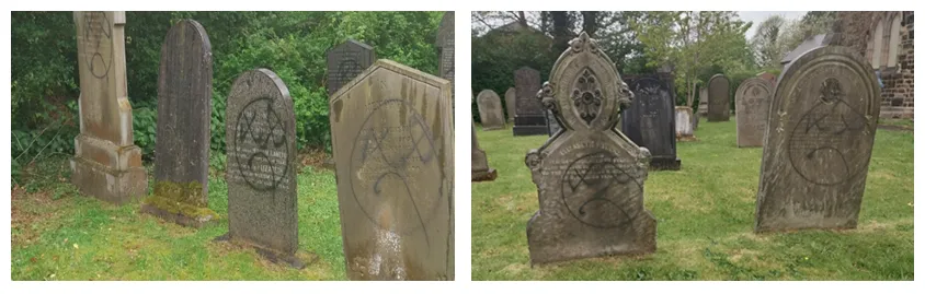 gravestones daubed with graffiti